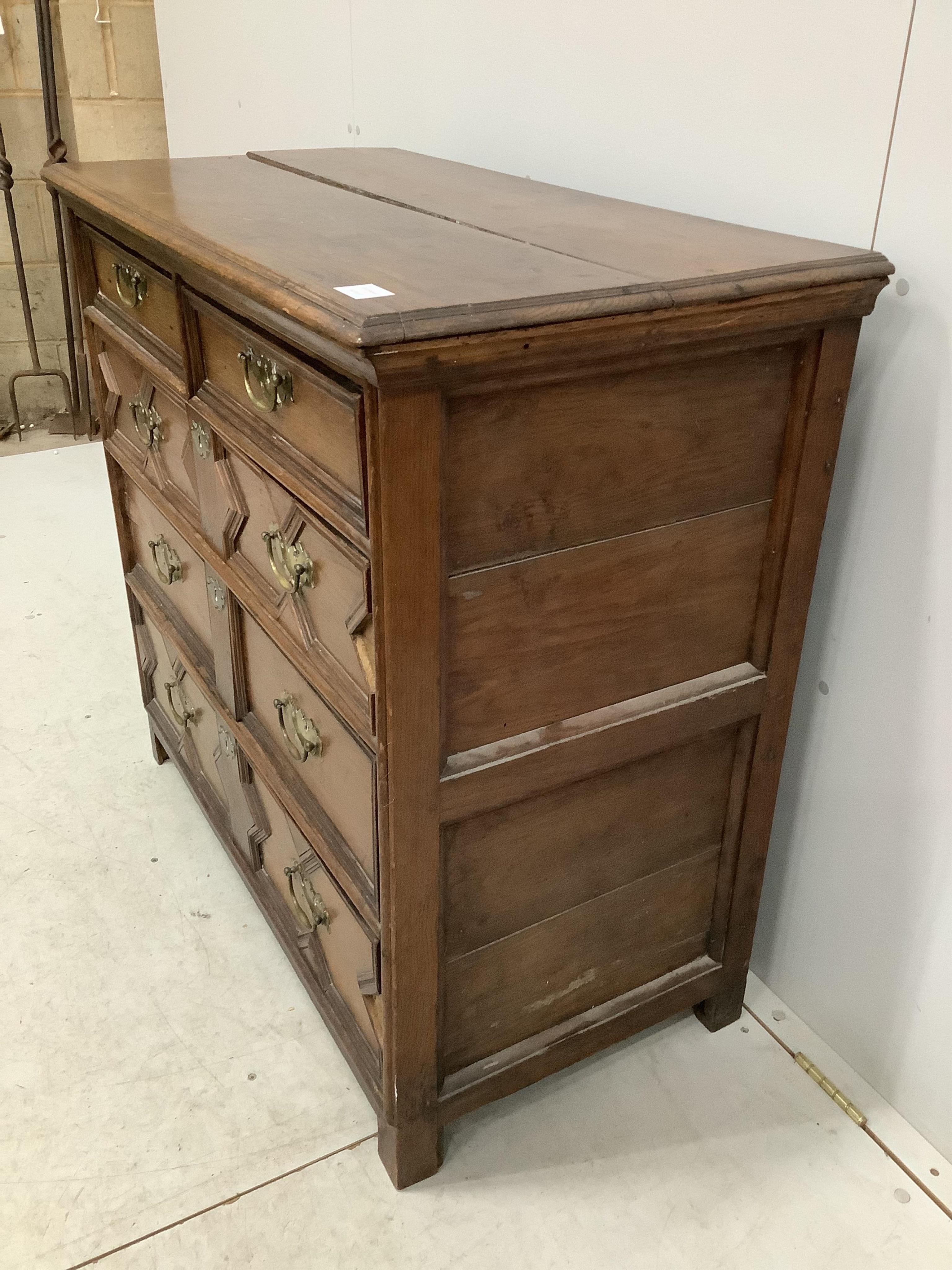 A Carolean geometric moulded oak chest of drawers, width 97cm, depth 51cm, height 91cm. Condition - poor